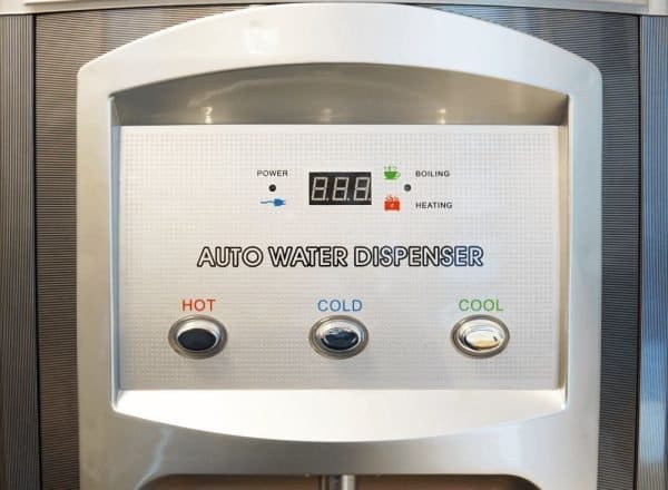 Automatic water dispenser machine with hot, cold, and cool water options, digital display, and easy-to-use buttons for efficient hydration and water temperature control.