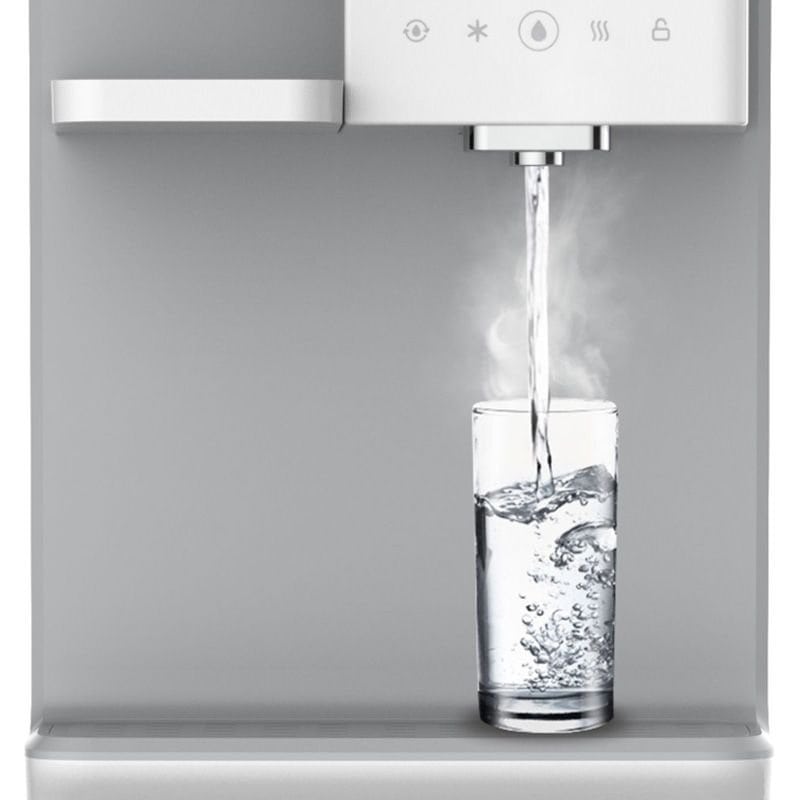 Pure water being filtered by modern water dispenser for clean drinking water.
